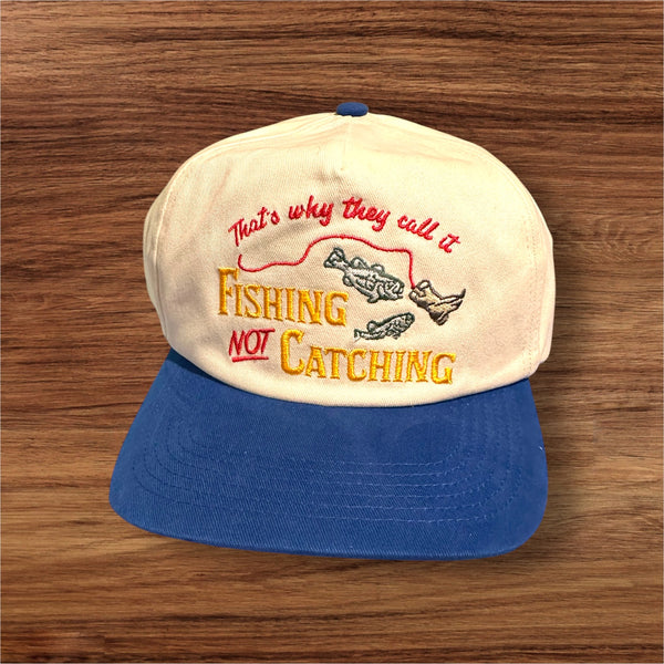 “They Call It Fishing, Not Catching” Cap